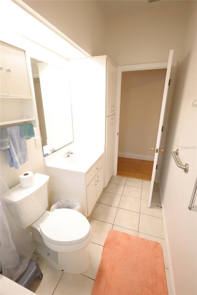 bathroom featuring tile patterned flooring and toilet