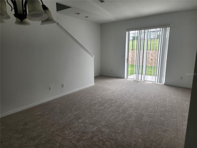 unfurnished room featuring baseboards and carpet flooring