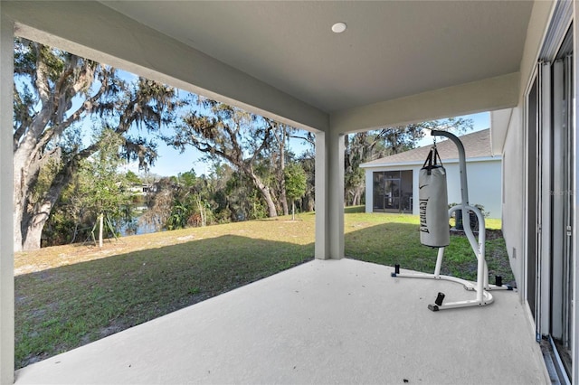 view of patio featuring a water view