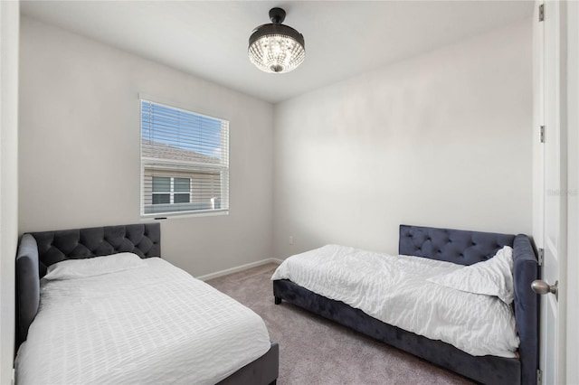 carpeted bedroom featuring baseboards