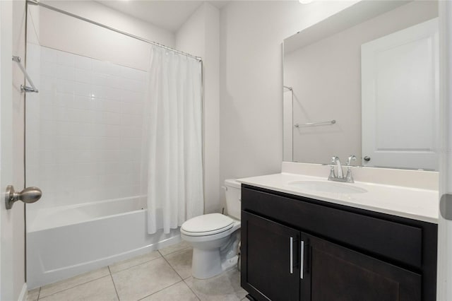 full bath with tile patterned flooring, vanity, toilet, and shower / bath combo with shower curtain