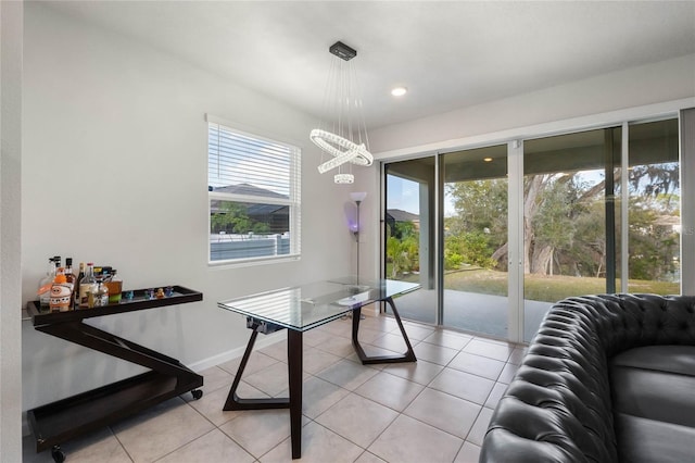 dining space with light tile patterned floors, baseboards, and recessed lighting