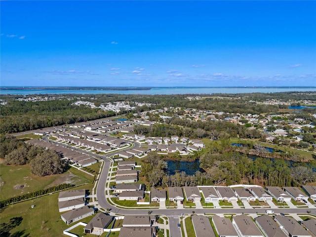 bird's eye view featuring a water view and a residential view