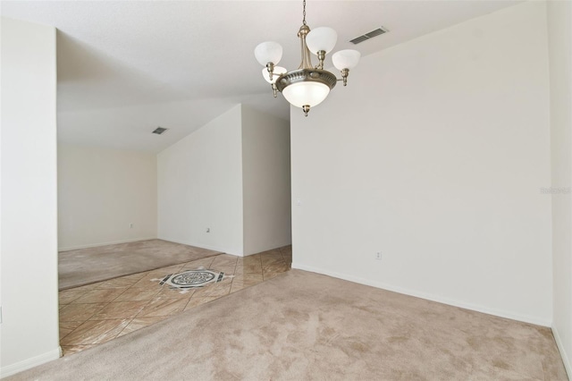 unfurnished room with a chandelier, light colored carpet, visible vents, and baseboards