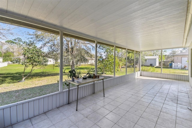 unfurnished sunroom featuring wooden ceiling