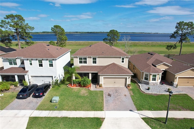 aerial view featuring a water view and a residential view