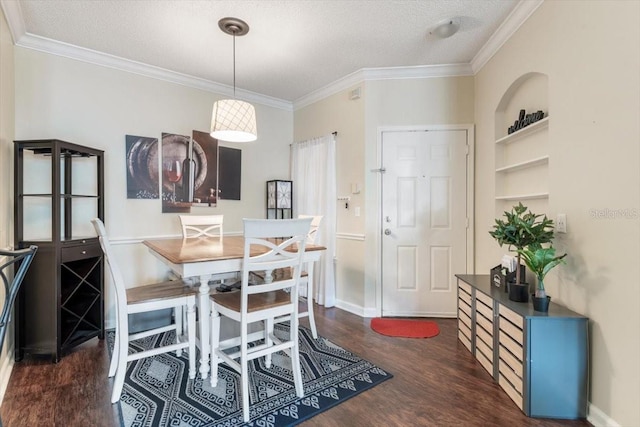 dining area with built in features, baseboards, dark wood-style floors, crown molding, and a textured ceiling