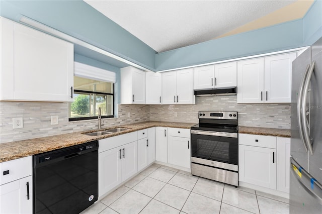 kitchen with under cabinet range hood, appliances with stainless steel finishes, white cabinets, and a sink