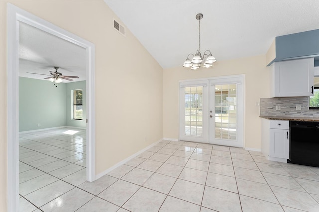 unfurnished dining area featuring french doors, light tile patterned floors, lofted ceiling, visible vents, and baseboards