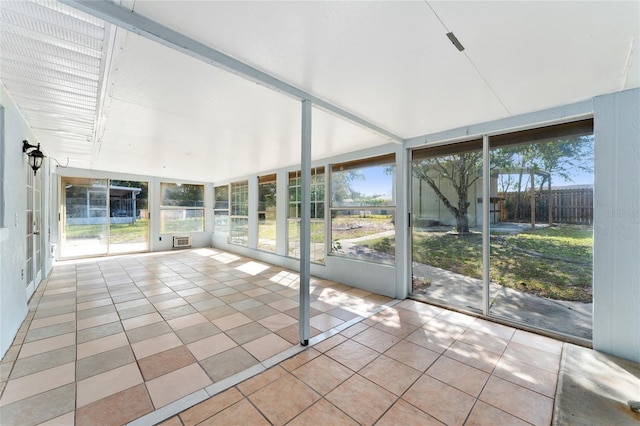 unfurnished sunroom featuring a wealth of natural light