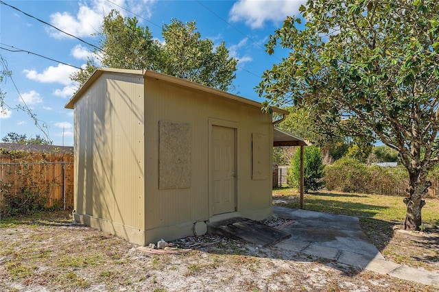 view of shed with fence