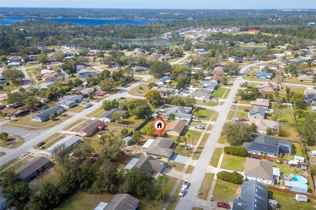 birds eye view of property with a residential view and a water view