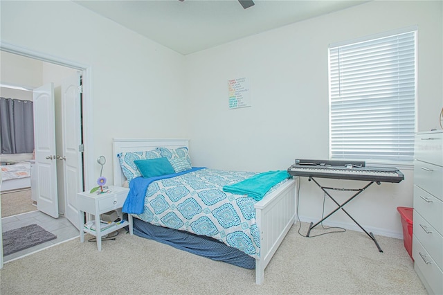 carpeted bedroom with ceiling fan