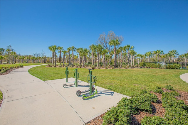 view of property's community featuring a yard