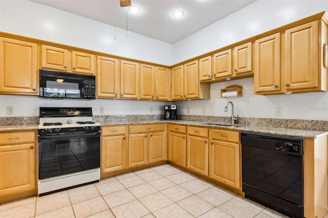 kitchen with light tile patterned floors, light stone countertops, black appliances, a sink, and recessed lighting