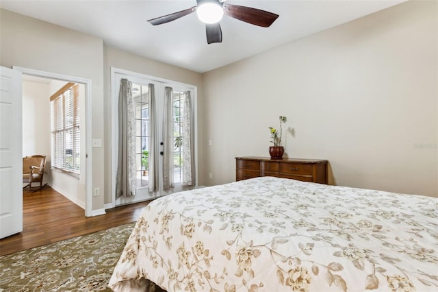 bedroom with access to exterior, baseboards, dark wood-style floors, and ceiling fan