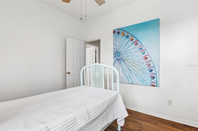 bedroom featuring dark wood-style floors, ceiling fan, and baseboards