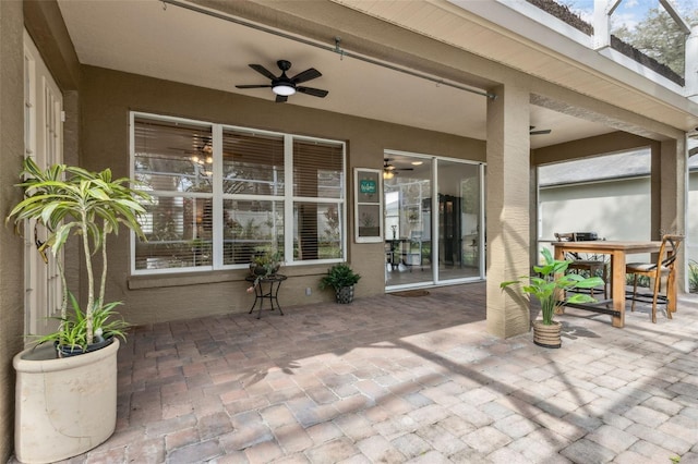 view of patio / terrace with outdoor dining area and a ceiling fan