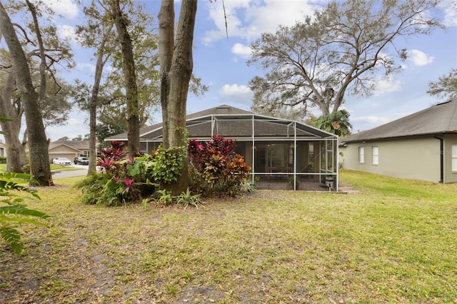 view of yard with a lanai