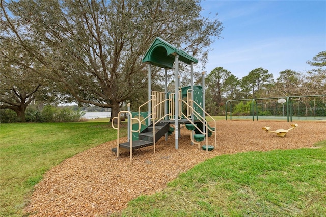 communal playground featuring a lawn