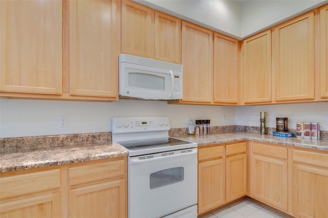 kitchen featuring white appliances and light brown cabinetry