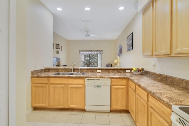 kitchen with visible vents, light brown cabinetry, a sink, dishwasher, and a peninsula