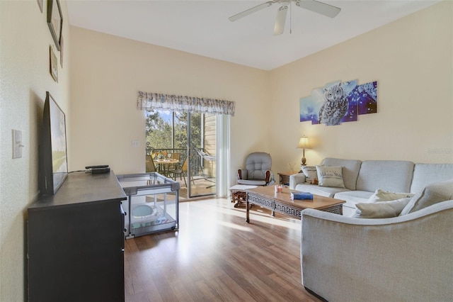 living area with ceiling fan and wood finished floors