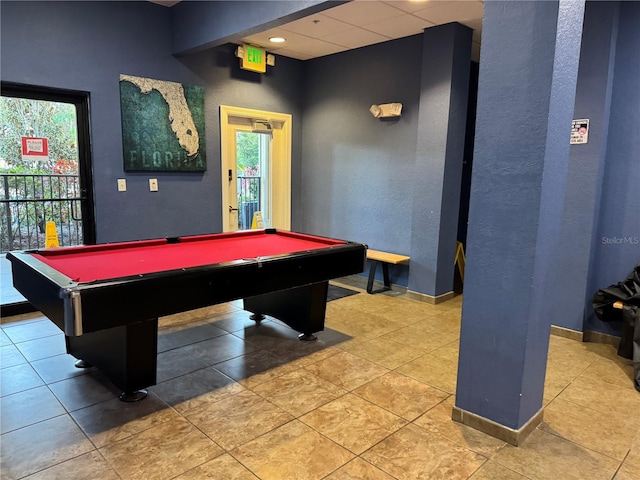 playroom with a textured wall, a drop ceiling, billiards, baseboards, and tile patterned floors