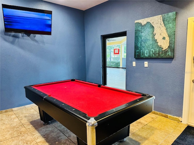 game room with pool table, baseboards, and a textured wall