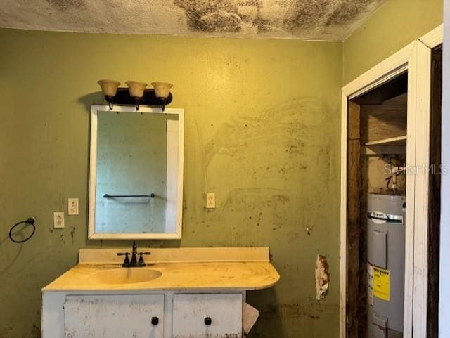 bathroom featuring water heater and vanity