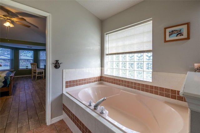 full bathroom featuring a garden tub and vaulted ceiling