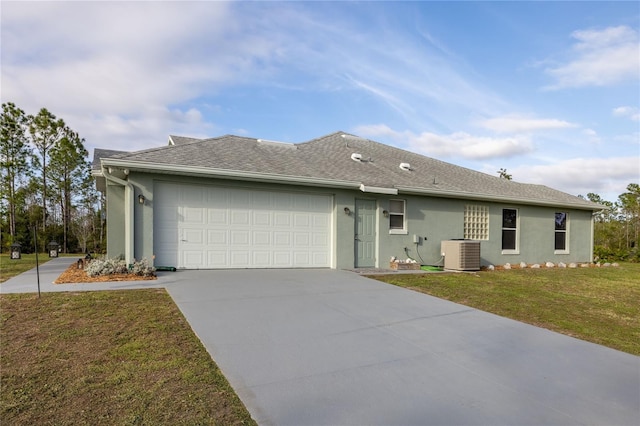 single story home featuring a garage, central AC unit, concrete driveway, a front lawn, and stucco siding