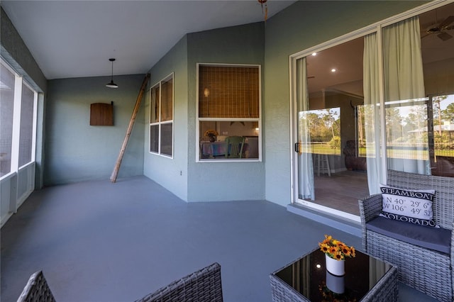 unfurnished sunroom with lofted ceiling and plenty of natural light