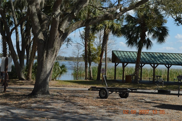 view of home's community featuring a water view and a gazebo