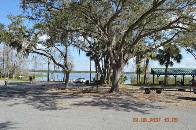 exterior space with a water view and a gazebo