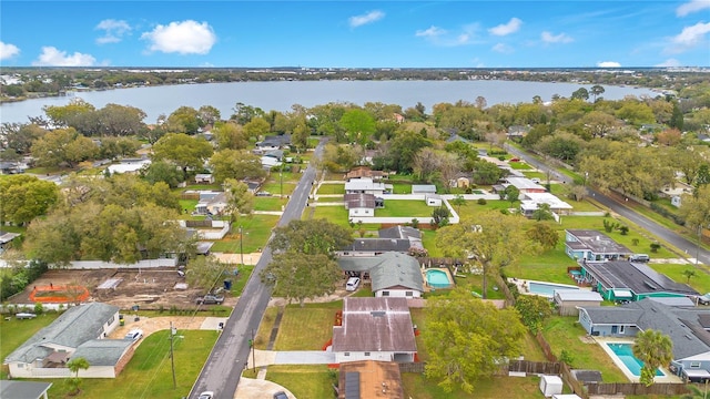 bird's eye view featuring a water view and a residential view