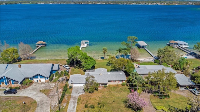 birds eye view of property with a water view