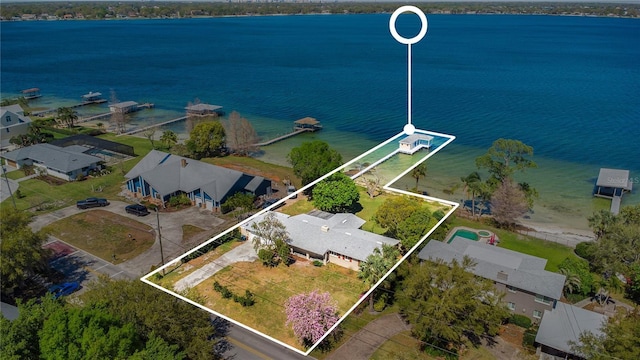 bird's eye view featuring a water view and a residential view