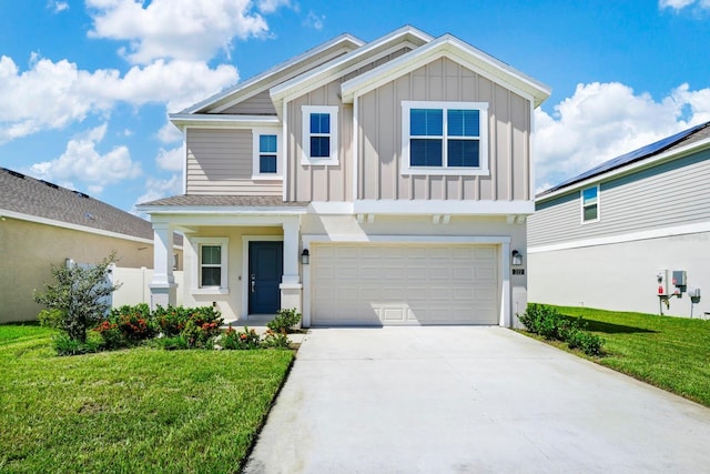 craftsman house featuring an attached garage, concrete driveway, board and batten siding, and a front yard