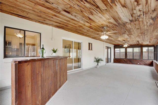 sunroom featuring wooden ceiling