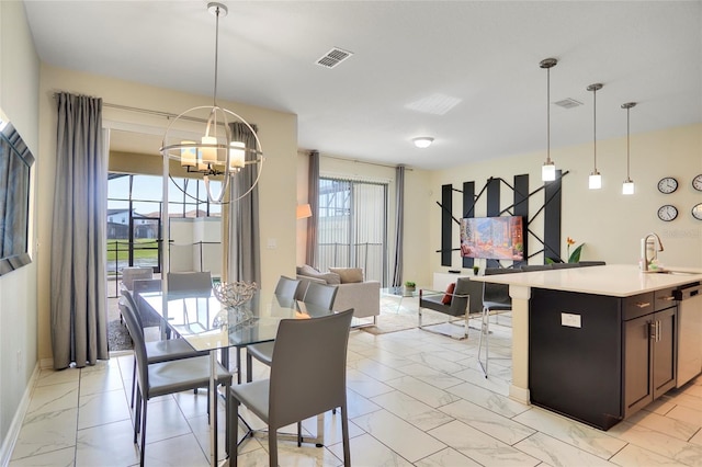dining room with baseboards, marble finish floor, visible vents, and a notable chandelier