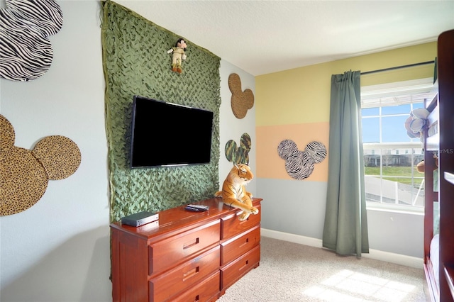 bedroom with carpet flooring and baseboards