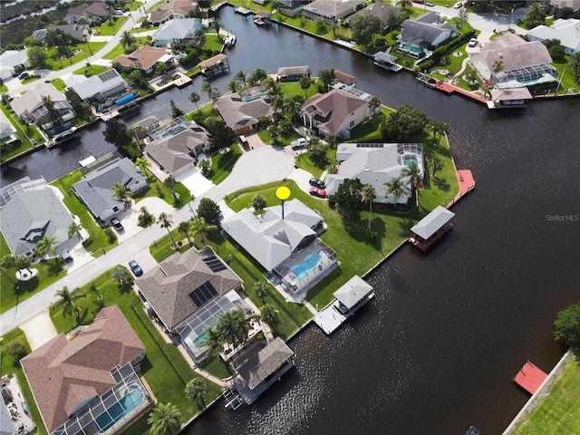 bird's eye view featuring a residential view and a water view