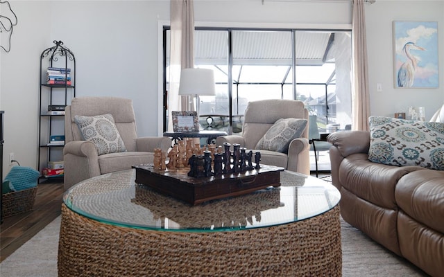 living area with a healthy amount of sunlight and light wood finished floors