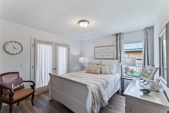 bedroom featuring dark wood-style floors and access to exterior