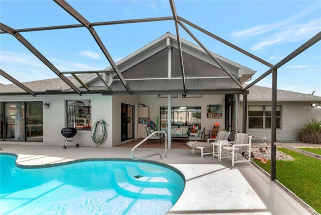 back of house featuring a lanai, a patio area, an outdoor pool, and stucco siding