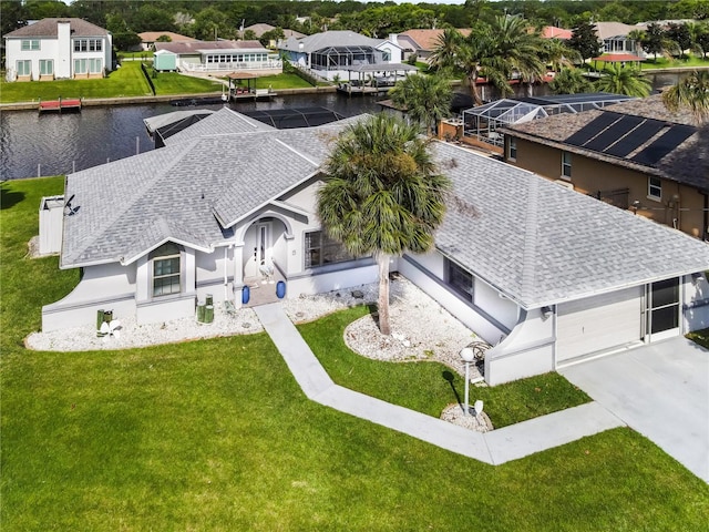 bird's eye view with a residential view and a water view