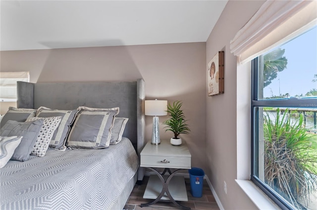 bedroom featuring baseboards