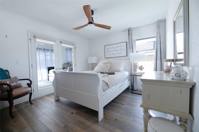 bedroom with ceiling fan, access to outside, dark wood-type flooring, and french doors