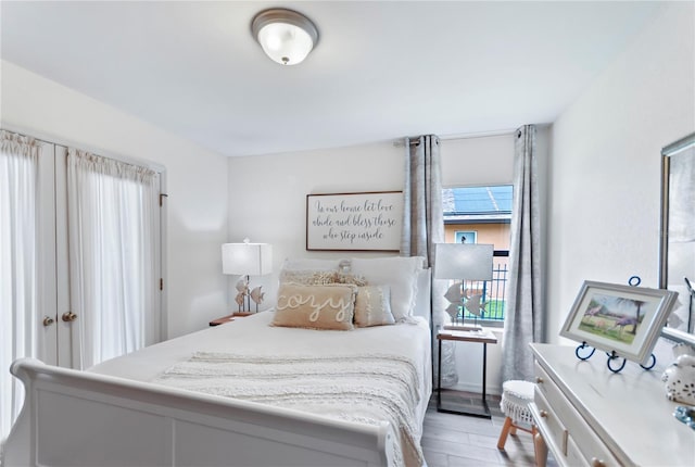 bedroom with light wood-style floors